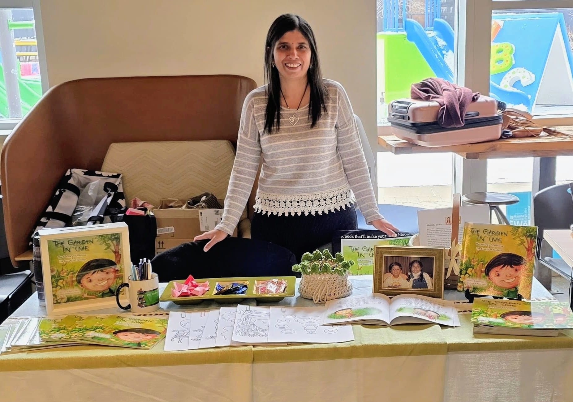 Author Nalina Siva at a display table with The Garden In Me